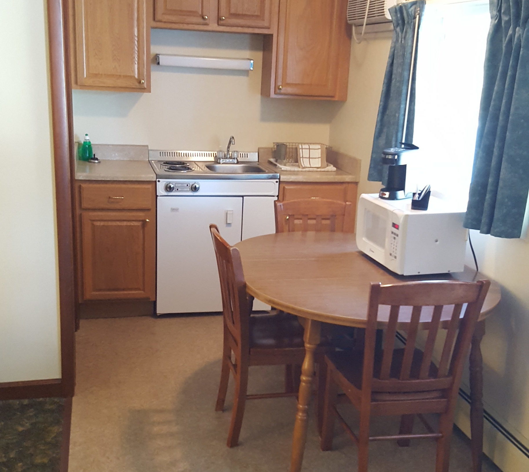 Motel room kitchenette and table.